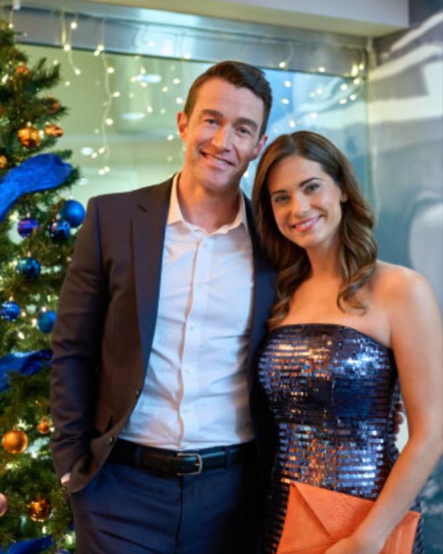 Avery in navy sequins and an orange clutch, from Holiday Touchdown: A Bears Love Story